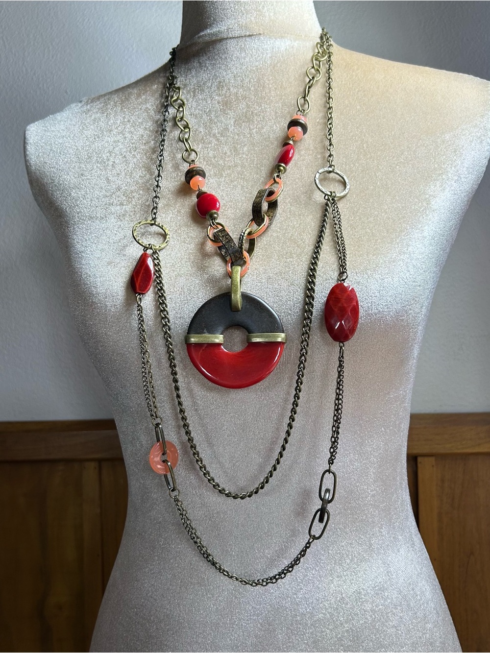 Multistrand Red brass tone long necklace